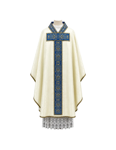 Regina Mariana Chasuble crafted in ivory damask fabric with royal blue orphrey and classic gold embroidery.