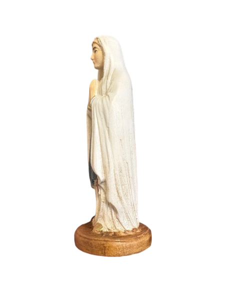 Side view of Our Lady of Lourdes wooden statue